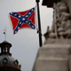 The Confederate flag flies on the Statehouse grounds in Columbia, S.C., June 23, 2015, one day after South Carolina Gov. Nikki Haley announced that she will call for the flag to be removed.
Win McNamee/Getty Images